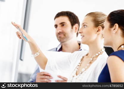 Business people in modern office. Business people working and discussing in modern office