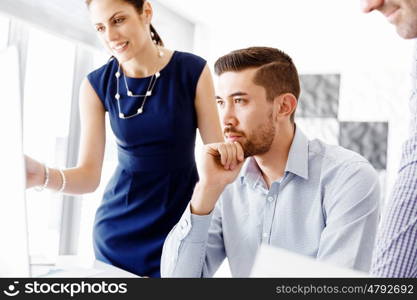 Business people in modern office. Business people working and discussing in modern office