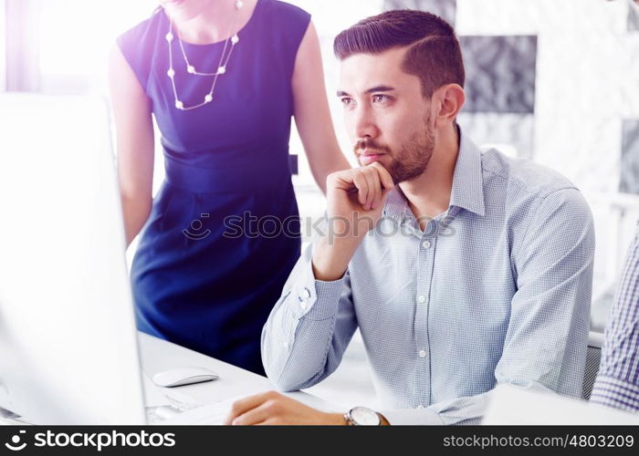 Business people in modern office. Business people working and discussing in modern office