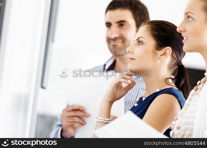 Business people in modern office. Business people working and discussing in modern office