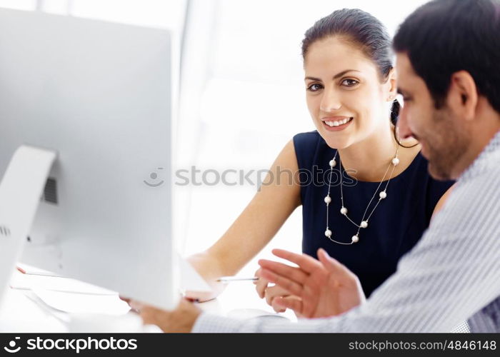 Business people in modern office. Business people working and discussing in modern office