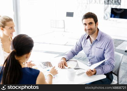 Business people in modern office. Business people working and discussing in modern office