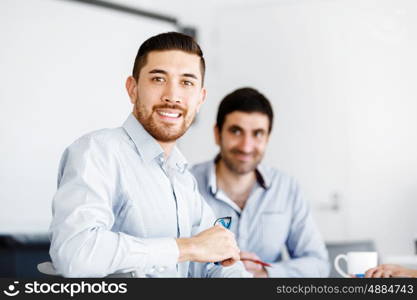 Business people in modern office. Business people working and discussing in modern office