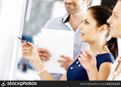 Business people in modern office. Business people working and discussing in modern office