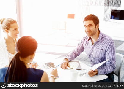 Business people in modern office. Business people working and discussing in modern office