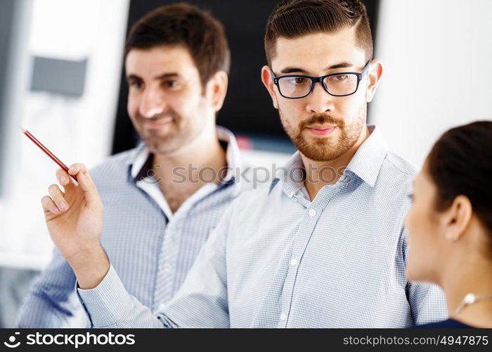 Business people in modern office. Business people working and discussing in modern office