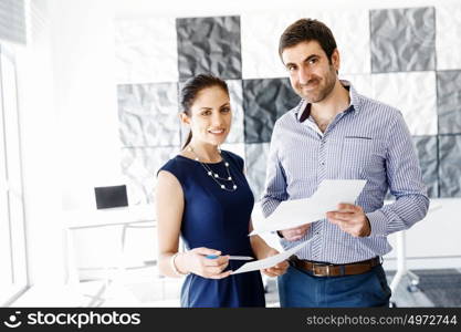 Business people in modern office. Business people working and discussing in modern office