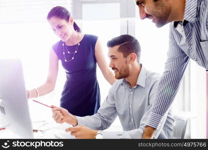 Business people in modern office. Business people working and discussing in modern office