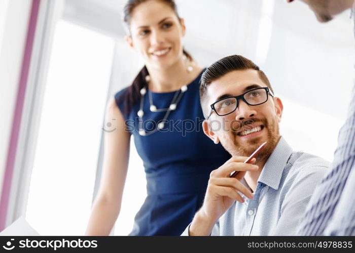 Business people in modern office. Business people working and discussing in modern office