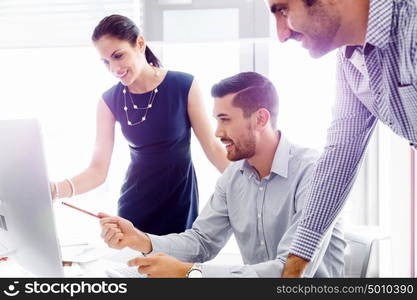 Business people in modern office. Business people working and discussing in modern office