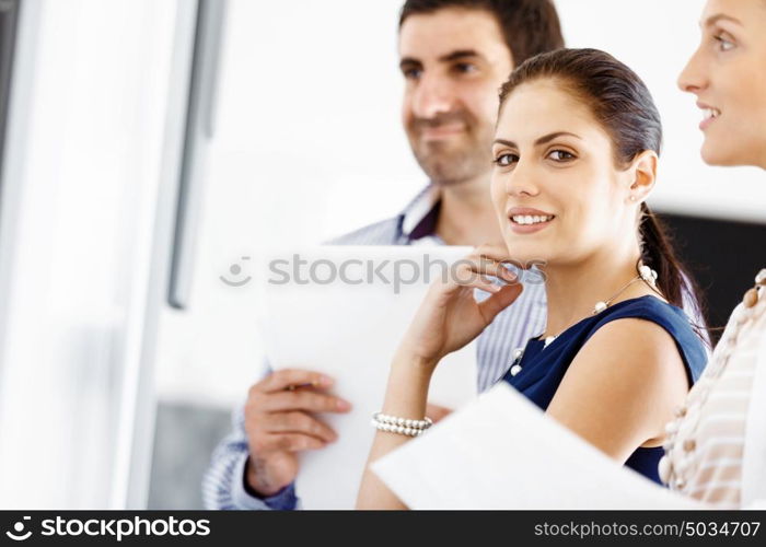 Business people in modern office. Business people working and discussing in modern office