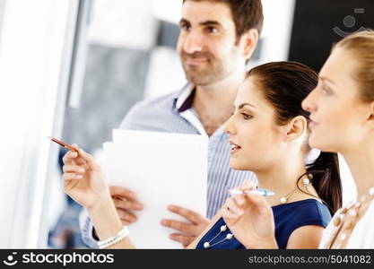 Business people in modern office. Business people working and discussing in modern office