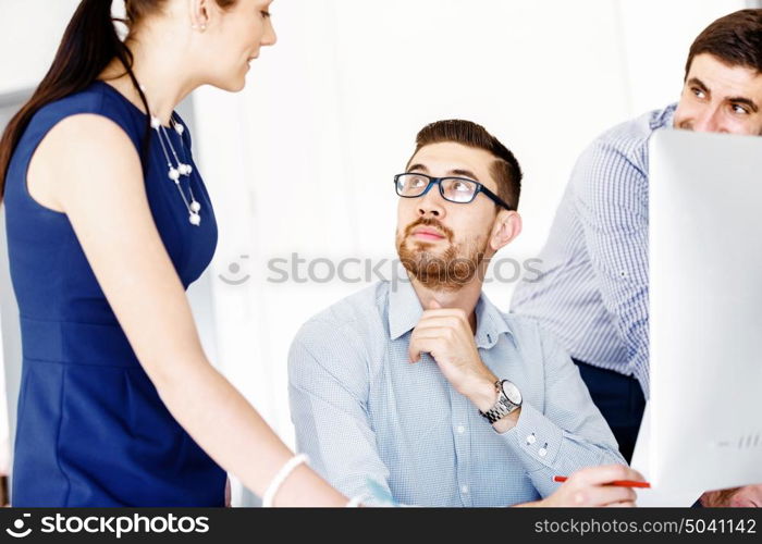 Business people in modern office. Business people working and discussing in modern office