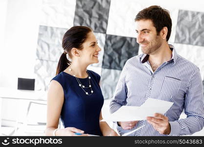 Business people in modern office. Business people working and discussing in modern office