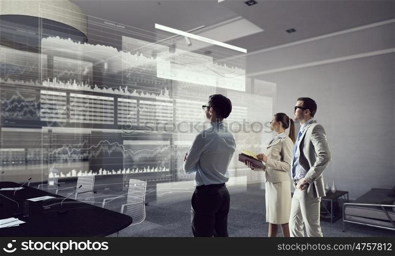 Business people in office mixed media. Business people in modern office interior working in cooperation