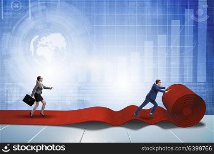 Business people in success concept with red carpet