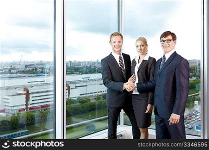 Business people in the background of a large window