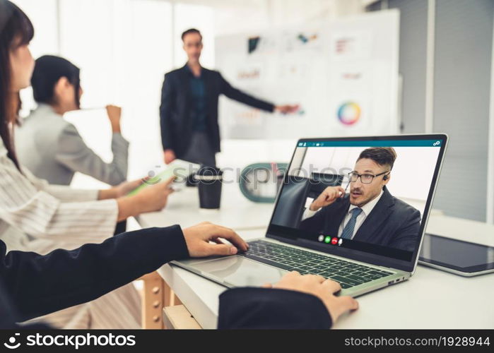 Business people in video call meeting proficiently discuss business plan in office and virual workplace . Telework conference call using smart video technology to communicate colleague .. Business Video Call