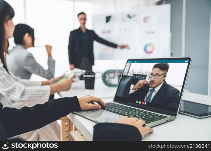 Business people in video call meeting proficiently discuss business plan in office and virual workplace . Telework conference call using smart video technology to communicate colleague .. Business people in video call meeting proficiently discuss business plan