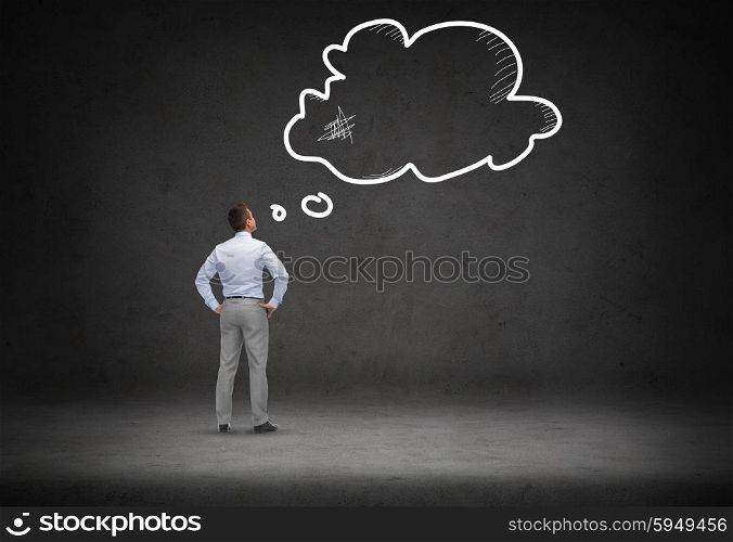 business, people, inspiration, communication and idea concept - businessman looking at empty text bubble over concrete room background from back