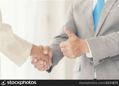 business people join hand while meeting in office