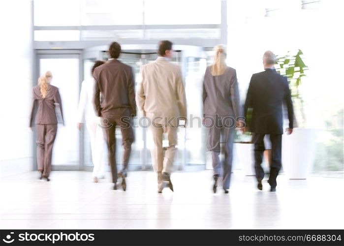 business people leaving office