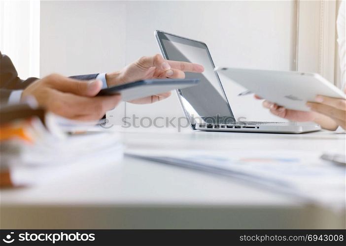 Business people making presentation with his colleagues and business tablet digital computer as meeting concept.