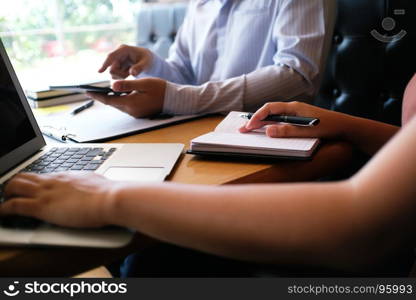 Business people making presentation with his colleagues and business tablet digital computer as meeting concept