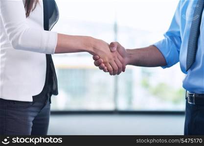 business people man and woman shake hands make deal and sign contract