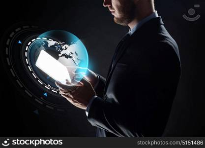 business, people, mass media and future technology concept - close up of businessman with transparent tablet pc computer and virtual earth virtual projection over black background. close up of businessman with transparent tablet pc