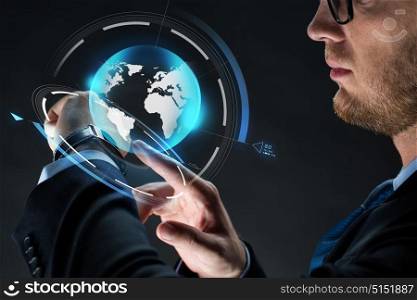 business, people, mass media and modern technology concept - close up of businessman with smartwatch and earth hologram over black background. close up of businessman with smartwatch