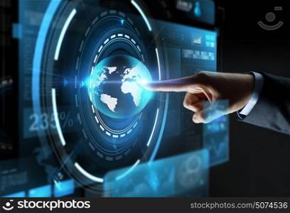 business, people, mass media and technology concept - close up of businessman hand pointing finger to virtual earth projection over black background. hand pointing finger to virtual earth projection
