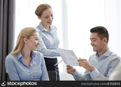 business, people, meeting and teamwork concept - smiling businesswoman giving papers to man in office