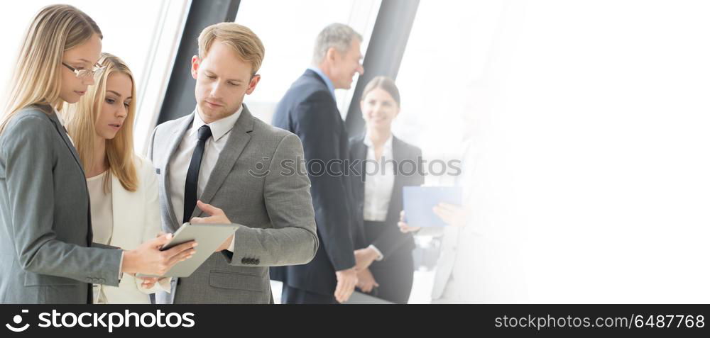 Business people meeting. Business people talking at meeting in office near window