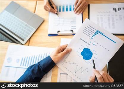 Business People Meeting to analyse and discuss and brainstorming the financial report chart data in office, Financial advisor teamwork and accounting concept