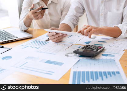 Business People Meeting to analyse and discuss and brainstorming the financial report chart data in office, Financial advisor teamwork and accounting concept