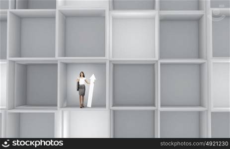 Business people. Miniature of young businesswoman standing in cube