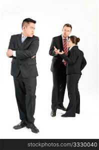 Business people (multi-ethnic) pointing their fingers on a colleague - mobbing