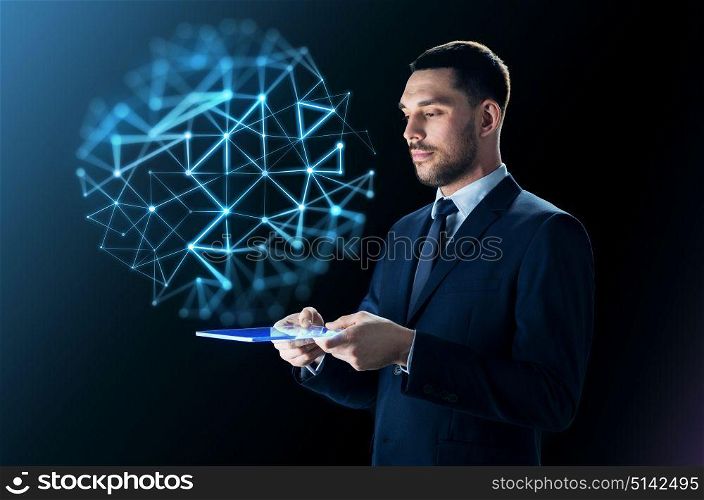 business, people, network and modern technology concept - businessman in suit working with transparent tablet pc computer and virtual low poly projection over black background. businessman with tablet pc and network projection