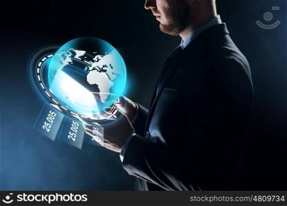 business, people, network, mass media and future technology concept - close up of businessman with tablet pc computer and earth globe hologram over dark background