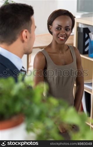 Business people of different human races chatting at office together