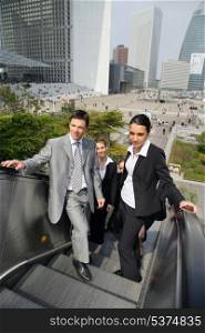 Business people on an escalator