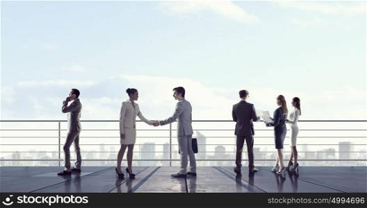 Business people on building top. Outdoor business meeting on roof of building