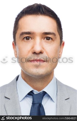 business, people, portrait and office concept - happy smiling businessman in suit
