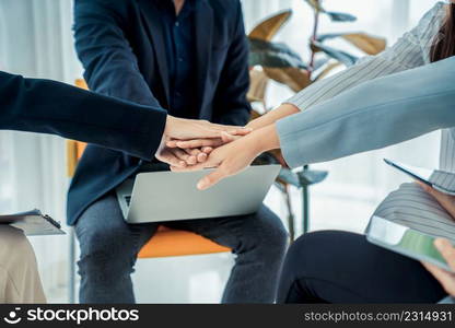 Business people proficiently celebrate project success at office workplace . Corporate business team collaboration concept .. Business people proficiently celebrate project success at office workplace