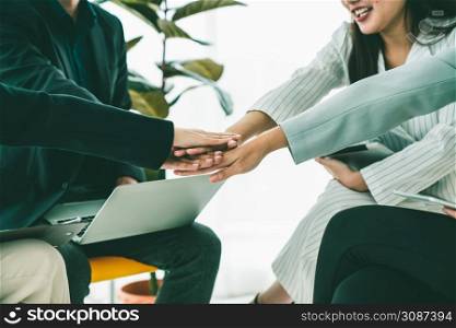 Business people proficiently celebrate project success at office workplace . Corporate business team collaboration concept .. Business people proficiently celebrate project success at office workplace
