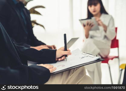 Business people proficiently discuss work project while sitting in circle . Corporate business team collaboration concept .. Business people proficiently discuss work project while sitting in circle