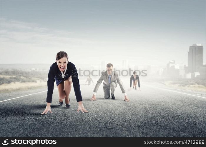 Business people running race. Business people on road in start position ready to run