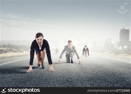 Business people running race. Business people on road in start position ready to run