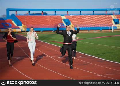 business people running together on racing track